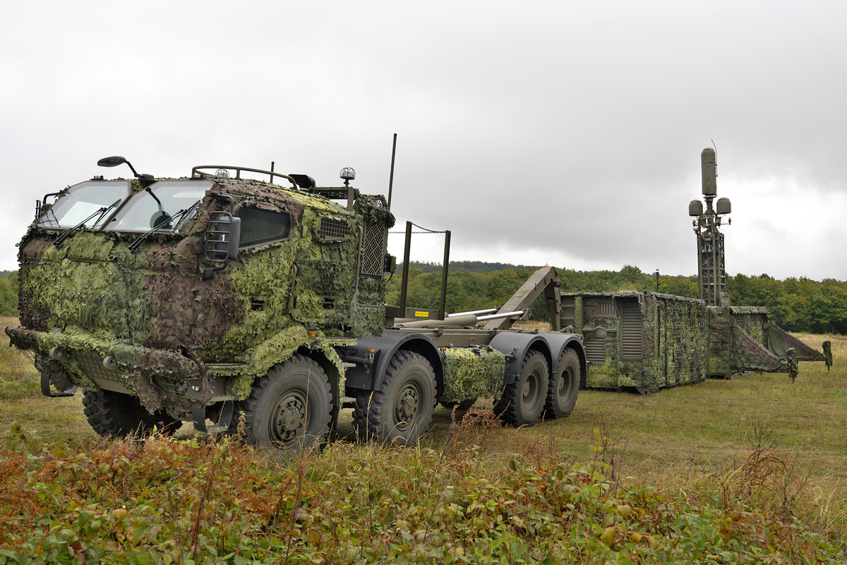 Picture: The antennas and main control station of the DPET system are housed in ISO-1C containers, which are transported by Tatra T-815 8x8 vehicles with hook loaders | DEFENSE MAGAZINE